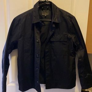 A black Banana Republic water resistant performance jacket.